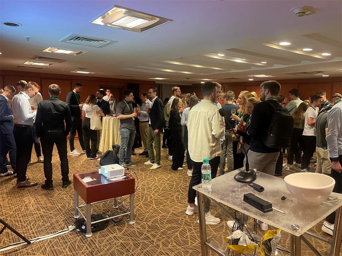 Members networking at the AIS Chapter Germany Reception at ICIS 2023